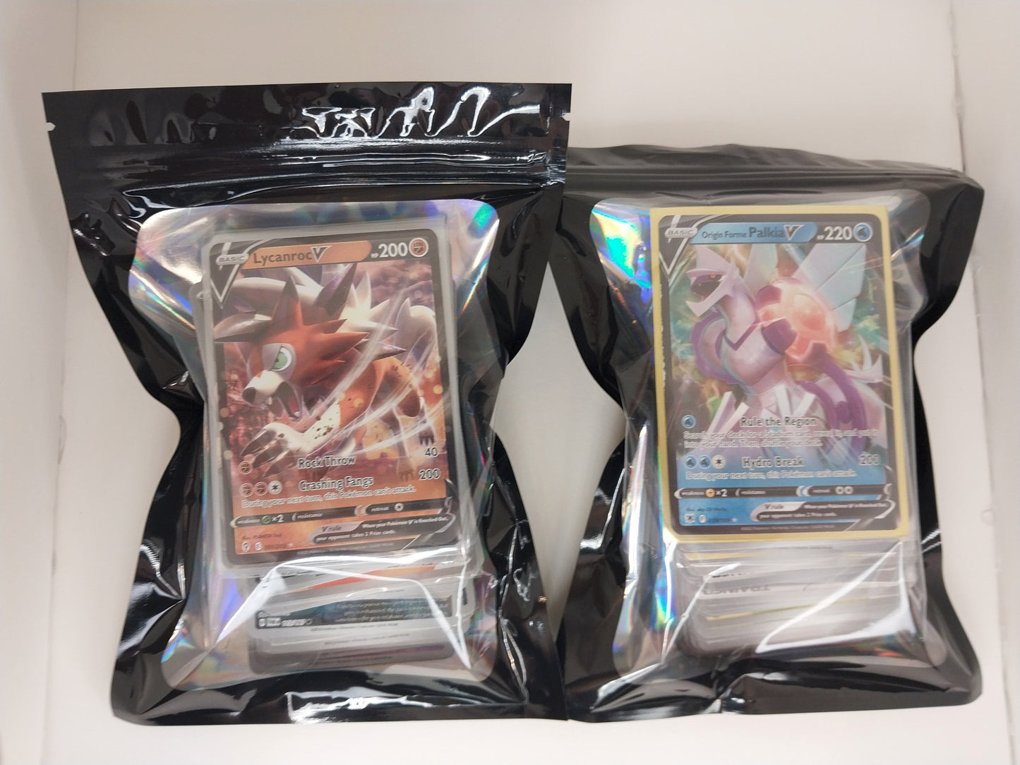 Two trading card packs with cards featuring characters on a white background